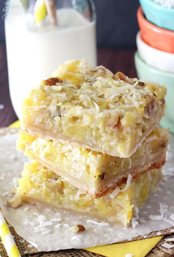 Pineapple Coconut Bars stacked on a napkin