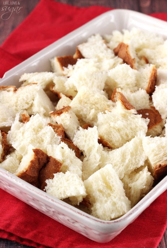 Ripped up bread pieces in a baking dish