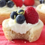 Berry Lemon Cheesecake Cookie Cups on red napkin with bite out