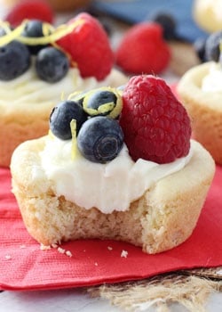 Berry Lemon Cheesecake Cookie Cups on red napkin with bite out