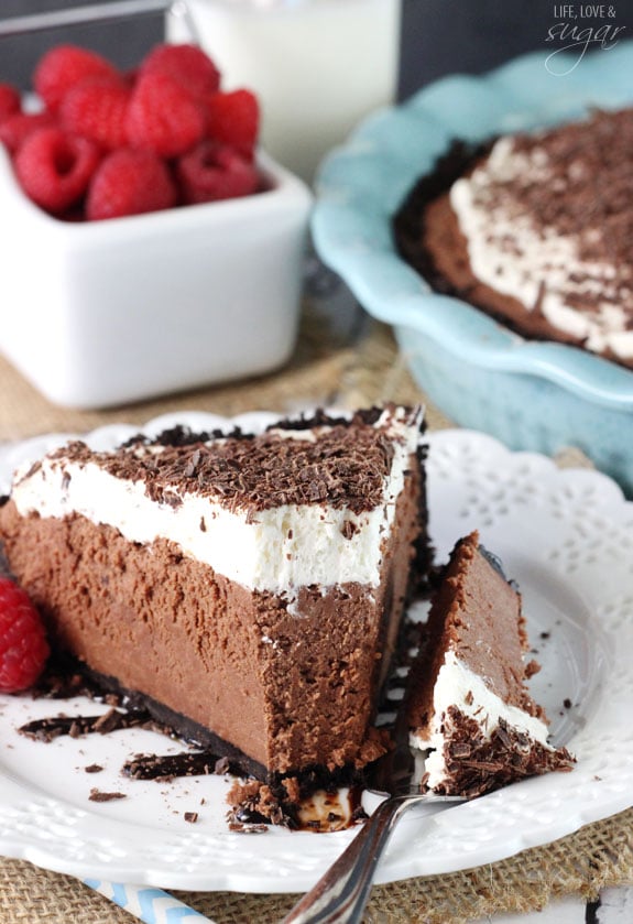 Chocolate Truffle Pie slice on a white plate with a bite on a fork