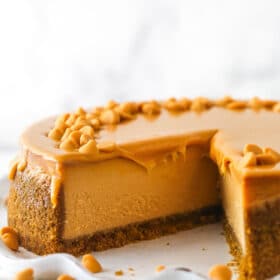 A butterscotch cheesecake with a slice missing