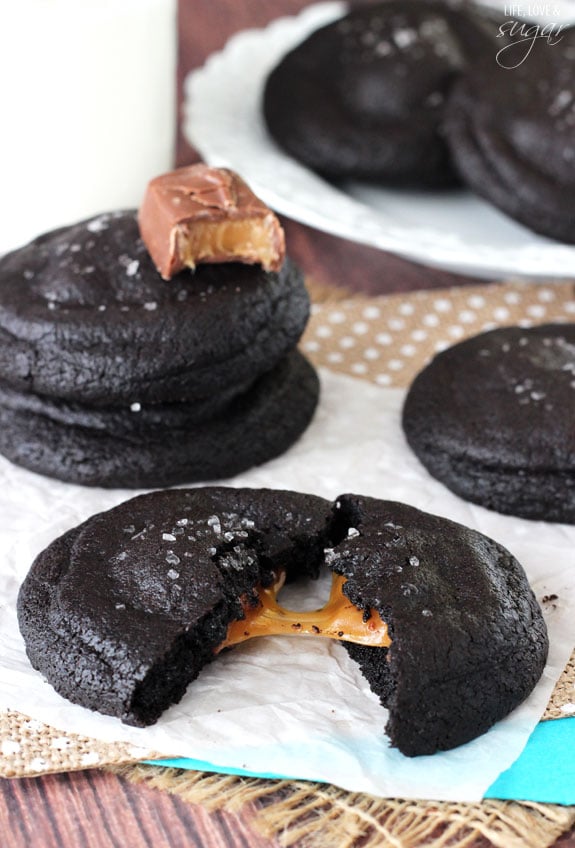 Salted Caramel Stuffed Dark Chocolate Cookie broken in half to reveal caramel filling