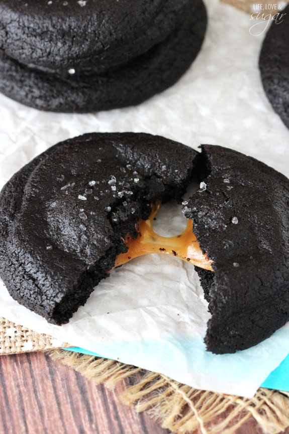 Salted Caramel Stuffed Dark Chocolate Cookie broken in half to reveal caramel filling
