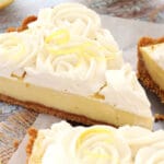 Creamy Lemon Tart with slice being removed close up