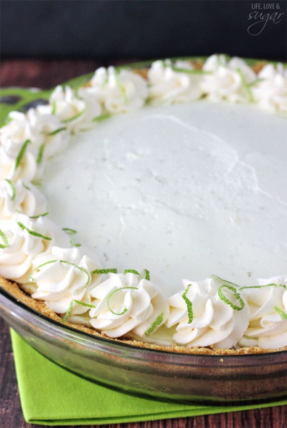 No Bake Margarita Pie with swirls of whipped cream and grated lime