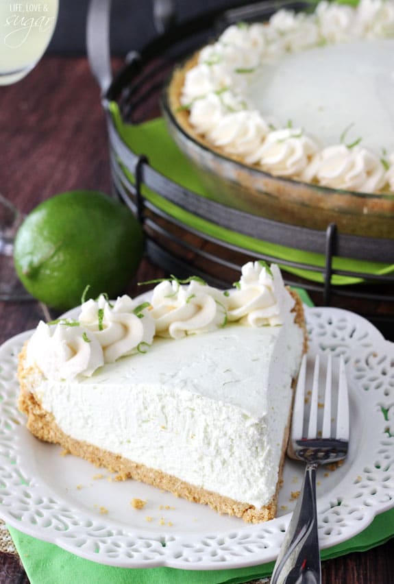 No Bake Margarita Pie slice on a plate in front of a whole pie
