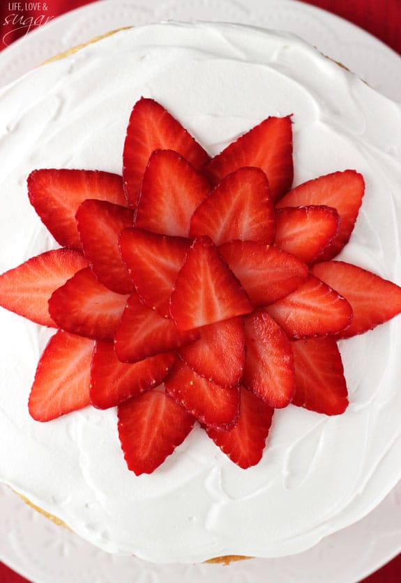 Strawberry Ice Cream Cake! Layers of soft vanilla cake with creamy strawberry ice cream!