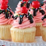 Strawberry Sundae Cupcakes on glass stand close up