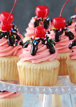 Strawberry Sundae Cupcakes on glass stand close up
