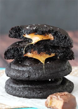 Salted Caramel Stuffed Chocolate Cookies stacked with top cookie halved