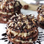 A close up of a German Chocolate Cookie Stack that has been drizzled with chocolate sauce