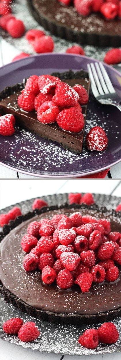 A slice of Nutella filled tart topped with sugar coated raspberries and a whole tart below it