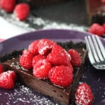 Nutella Raspberry Tart slice on purple plate