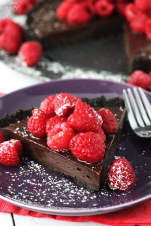 Nutella Raspberry Tart slice on purple plate