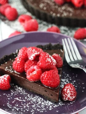 Nutella Raspberry Tart slice on purple plate