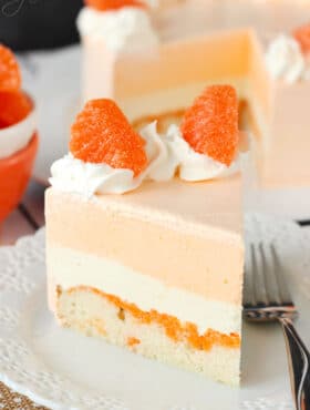 A slice of Orange Creamsicle Ice Cream Cake on a plate