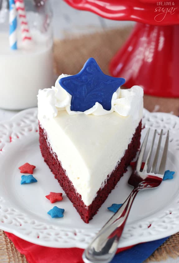 Red Velvet Blondie Cheesecake slice on a plate with a blue star on top