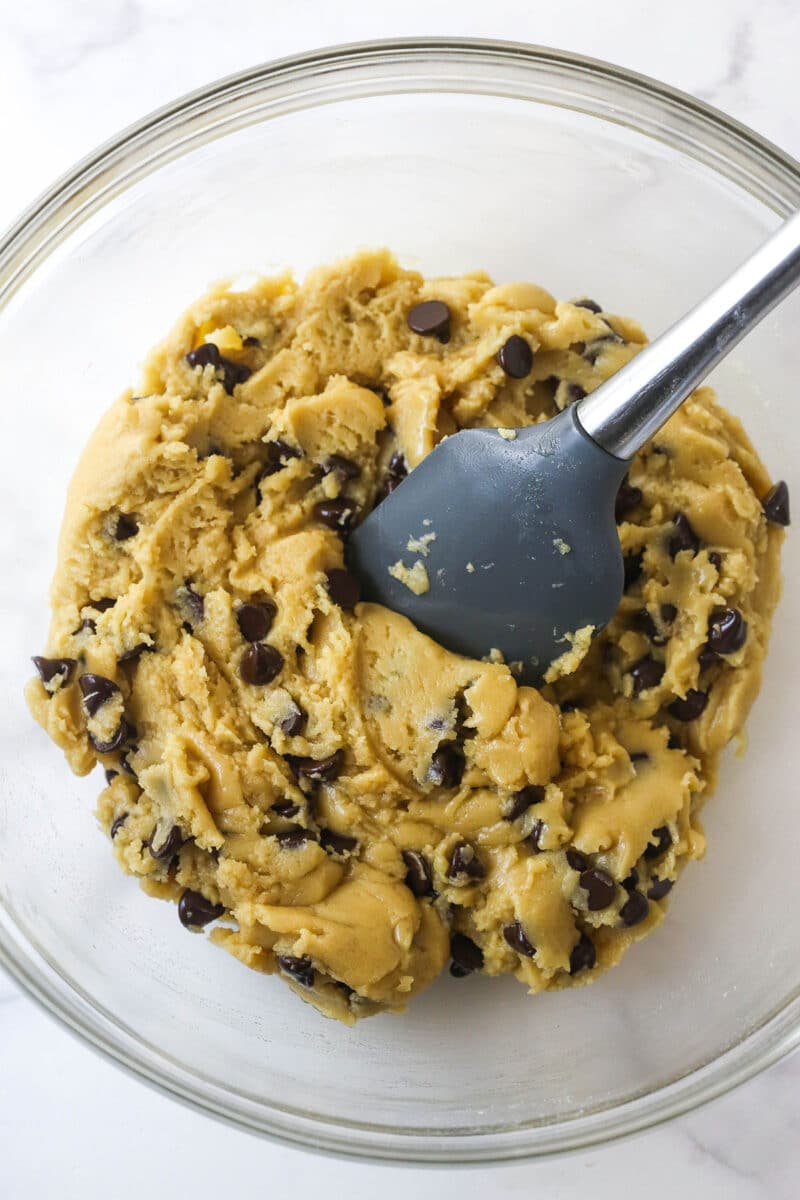 Folding chocolate chips into cookie dough