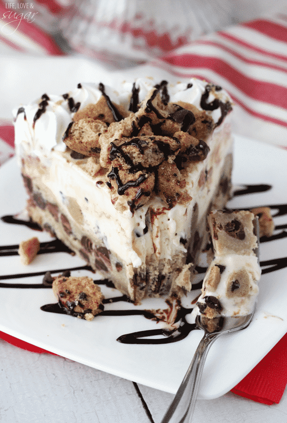 Chocolate Chip Cookie Ice Cream Cake - a layer of chocolate chip cookie with cook dough ice cream! Topped with chopped cookies, whipped cream and chocolate sauce!