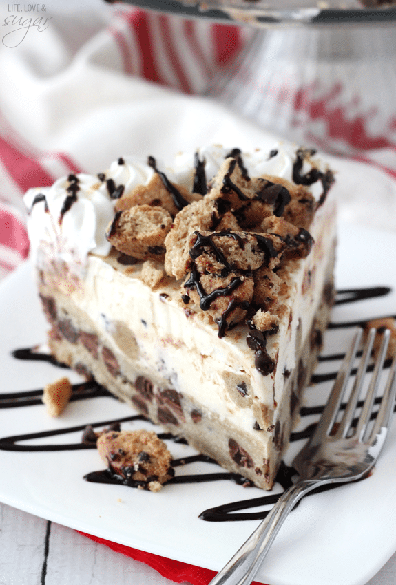 Chocolate Chip Cookie Ice Cream Cake - a layer of chocolate chip cookie with cook dough ice cream! Topped with chopped cookies, whipped cream and chocolate sauce!