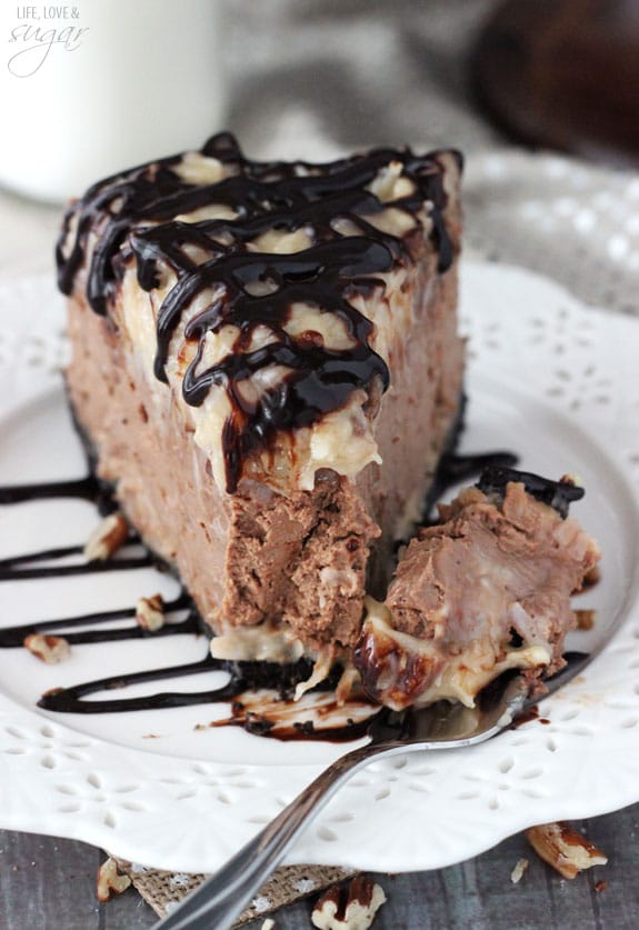 German Chocolate Cheesecake slice on a plate with a bite on a fork