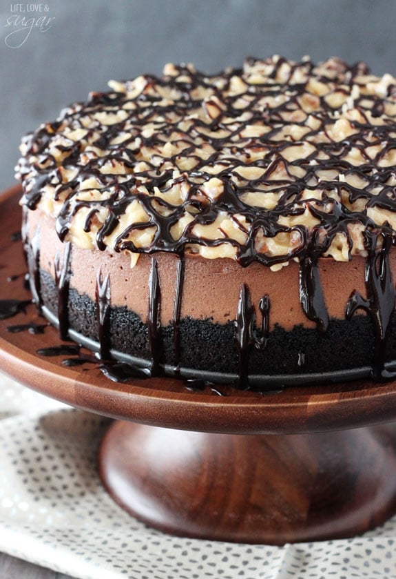German Chocolate Cheesecake on a wooden cake stand