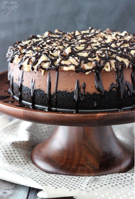 German Chocolate Cheesecake on a wooden stand