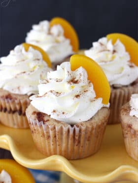 Close-up of Peach Cobbler Cupcakes on a yellow tray