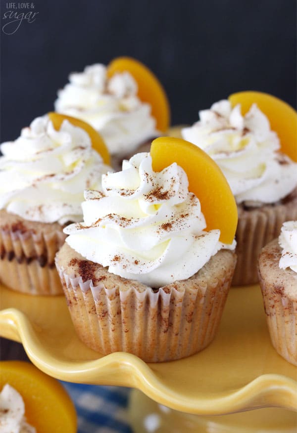 Close-up of Peach Cobbler Cupcakes on a yellow tray
