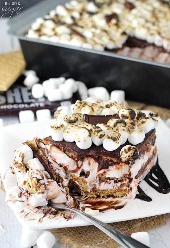 Smores Icebox Cake serving on a plate with a bite on a fork