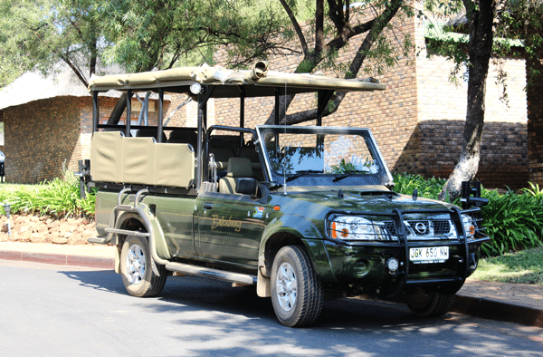 The Safari Game Drive Car Parked on the Side of the Road