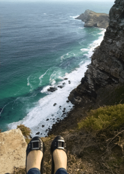 My feet dangling over the edge of a peak in South Africa.