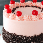 Cherry Chocolate Chip Cake on white stand close up