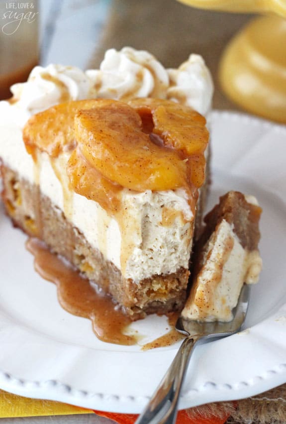 Peach Caramel Blondie Cheesecake slice on a white plate with a bite on a fork