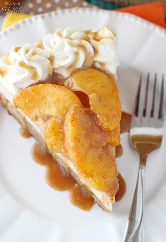 Overhead view of a slice of Peach Caramel Blondie Cheesecake on a white plate