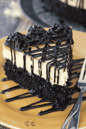 Peanut Butter Truffle Chocolate Cake slice on gold plate close up