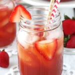 Close-up of a Mason Jar of Strawberry Vanilla Sweet Tea with two straws