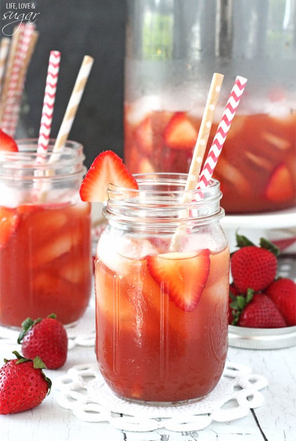 A Mason Jar of Strawberry Vanilla Sweet Tea with two straws