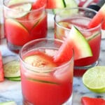 Three Watermelon Elderflower Cocktails Garnished with Watermelon Slices