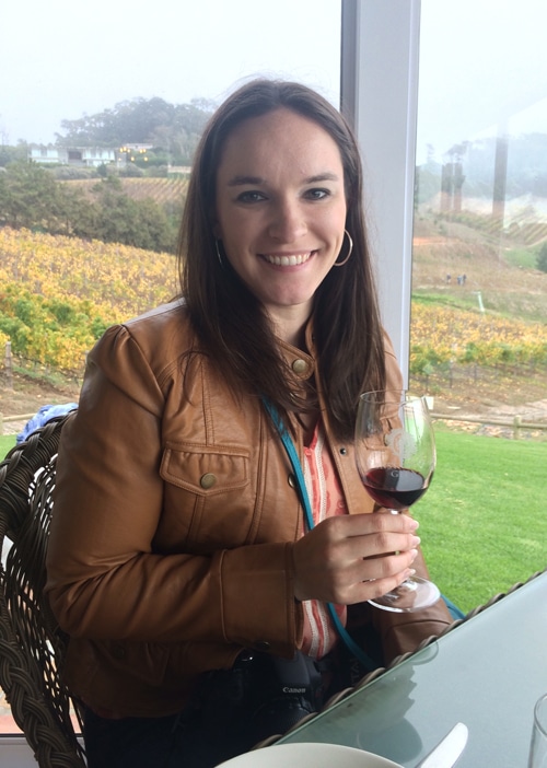 Author with a glass of red wine