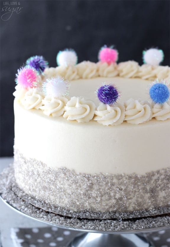 Sparkly Pom Pom Cake on a silver stand