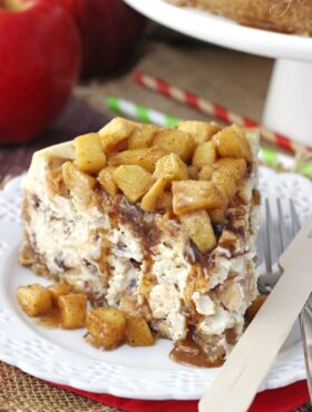 Apple Cinnamon Cheesecake on white plate close up