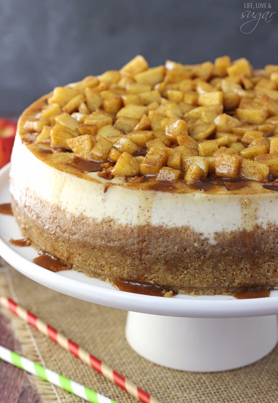 Apple Cinnamon Cheesecake - A cinnamon cheesecake layered with apples and cinnamon filling! Topped with even more apples and cinnamon! Absolutely to die for!