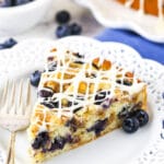 close up of slice of Blueberry Streusel Coffee Cake on white plate