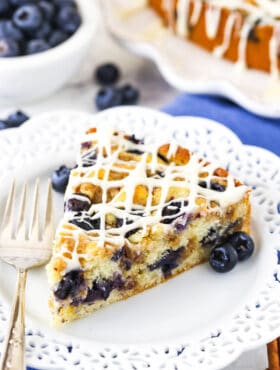 close up of slice of Blueberry Streusel Coffee Cake on white plate