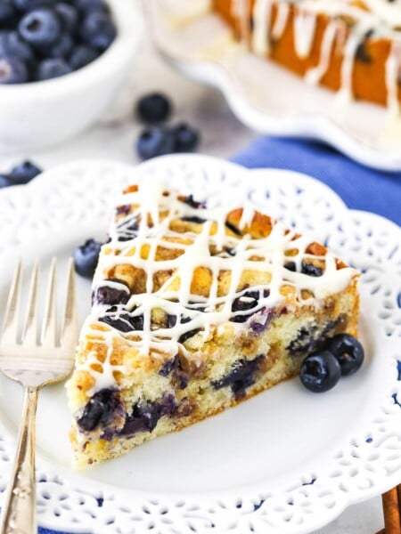close up of slice of Blueberry Streusel Coffee Cake on white plate