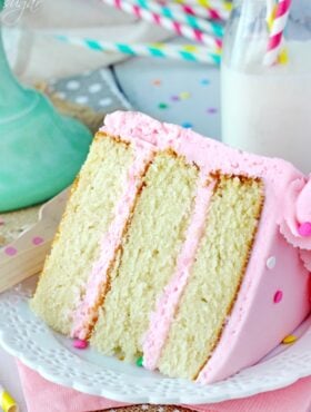 Moist and Fluffy Vanilla Cake slice on white plate 2 close up