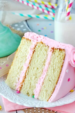 Moist and Fluffy Vanilla Cake slice on white plate 2 close up