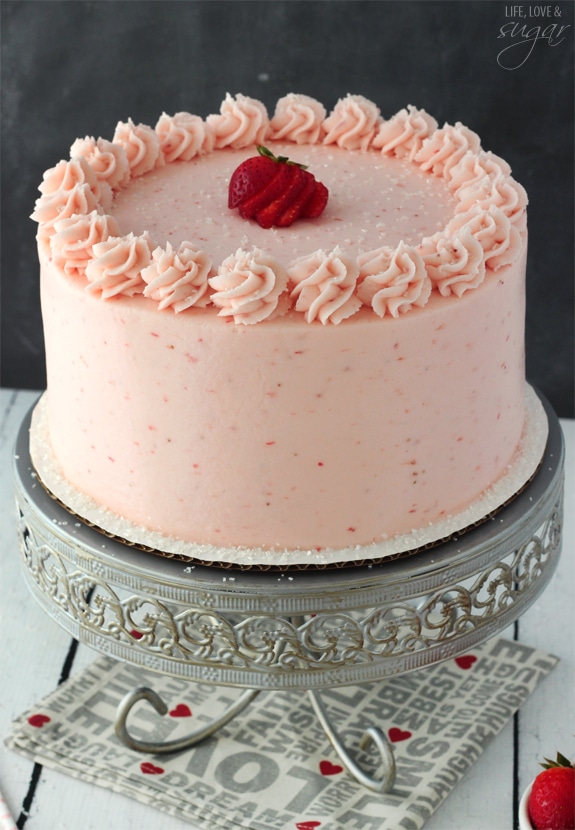 Strawberry Moscato Layer Cake on a metal stand